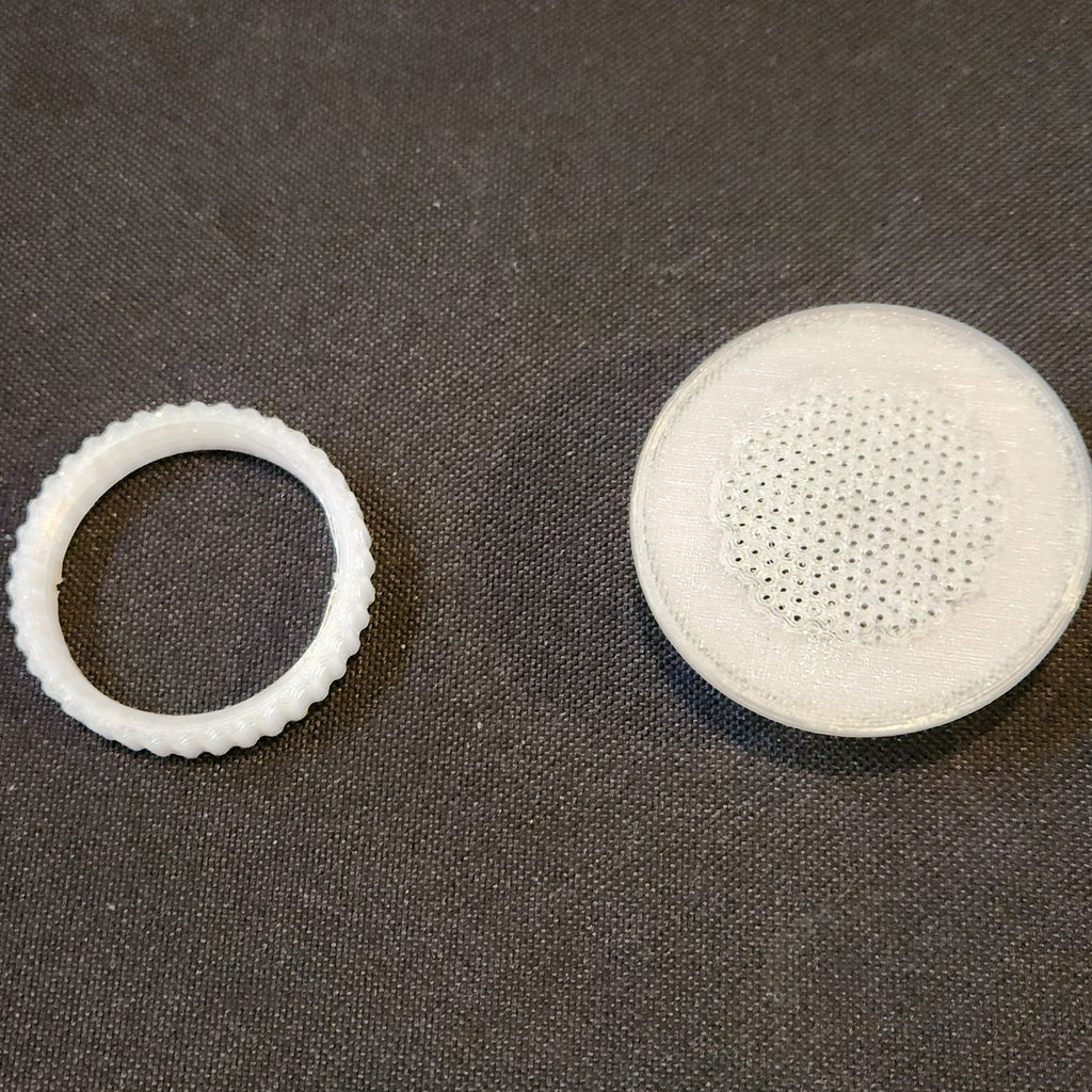 1.5 inch tub vent and its threaded nut, side by side
