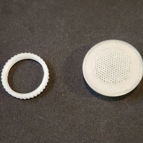 1.5 inch tub vent and its threaded nut, side by side