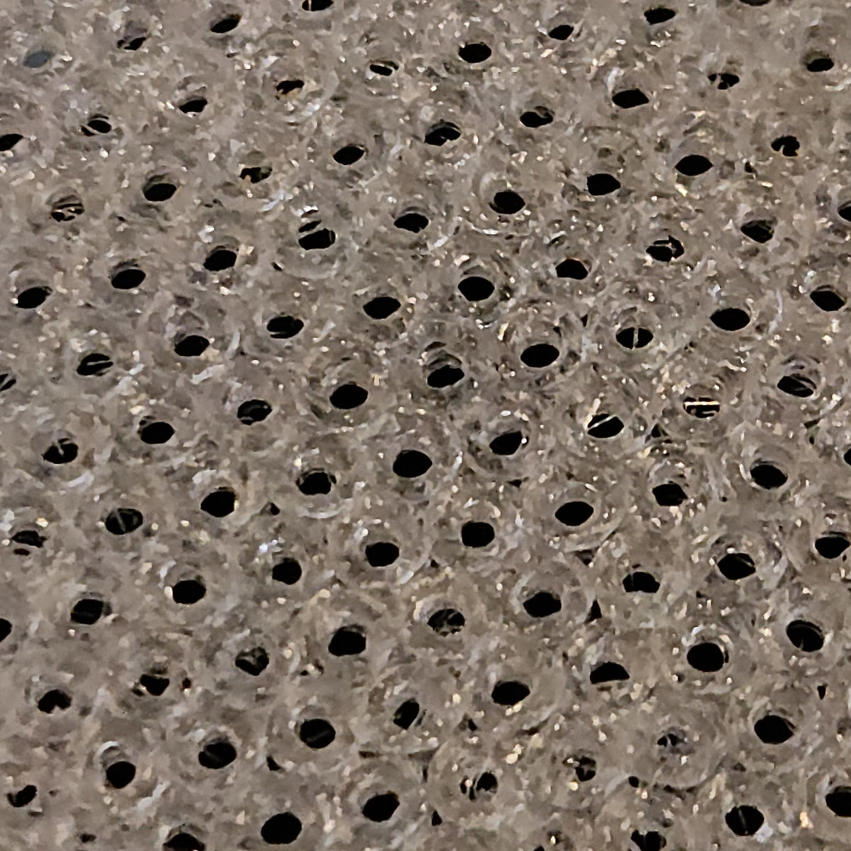 Close-up of the printed hex mesh on a 1.5 inch tub vent
