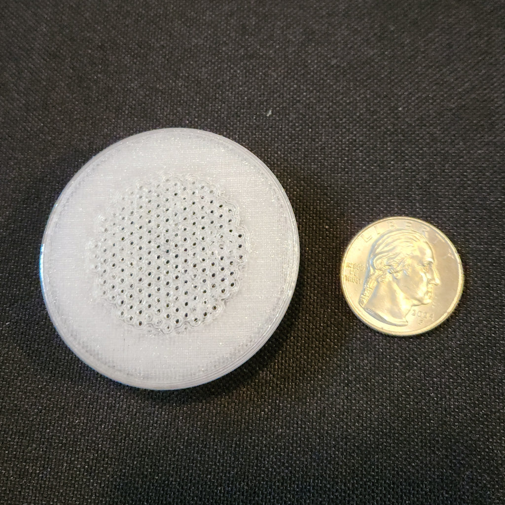 1.5 inch tub vent next to a US quarter for size